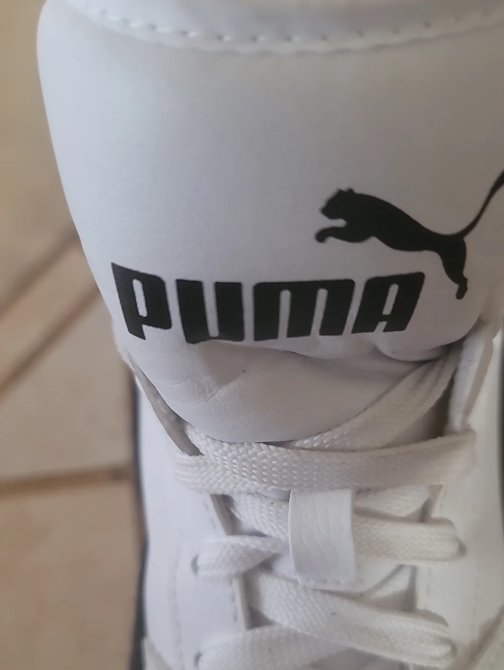 Puma White and Black Mid-Top Athletic Sneakers